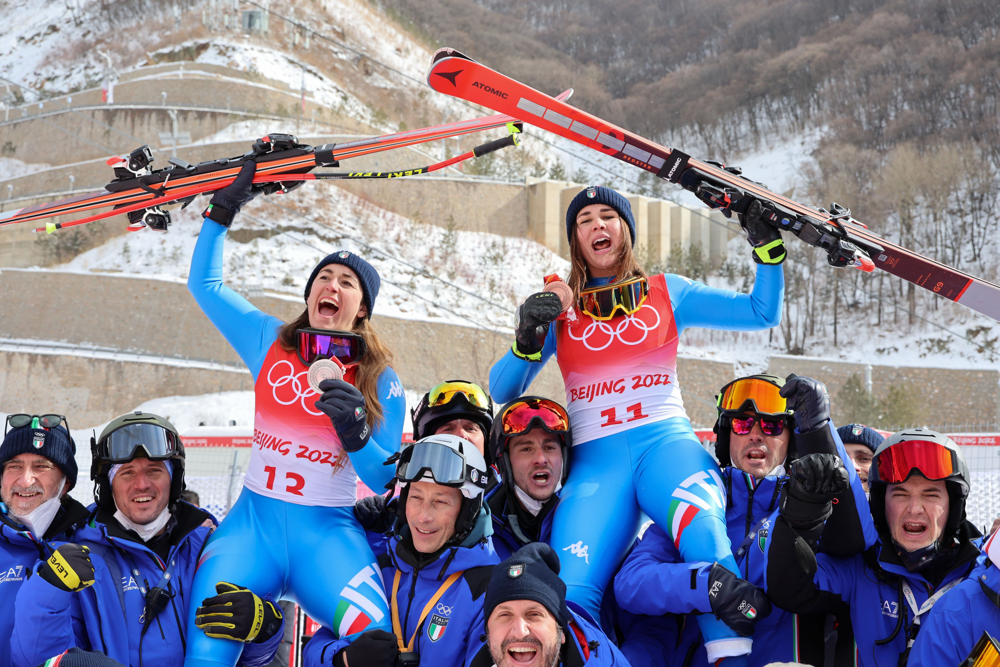 Sofia Goggia, left, and Nadia Delago, right, celebrated with the Italian team following their silver and bronze medals, which were hard earned for different reasons ©Getty Images