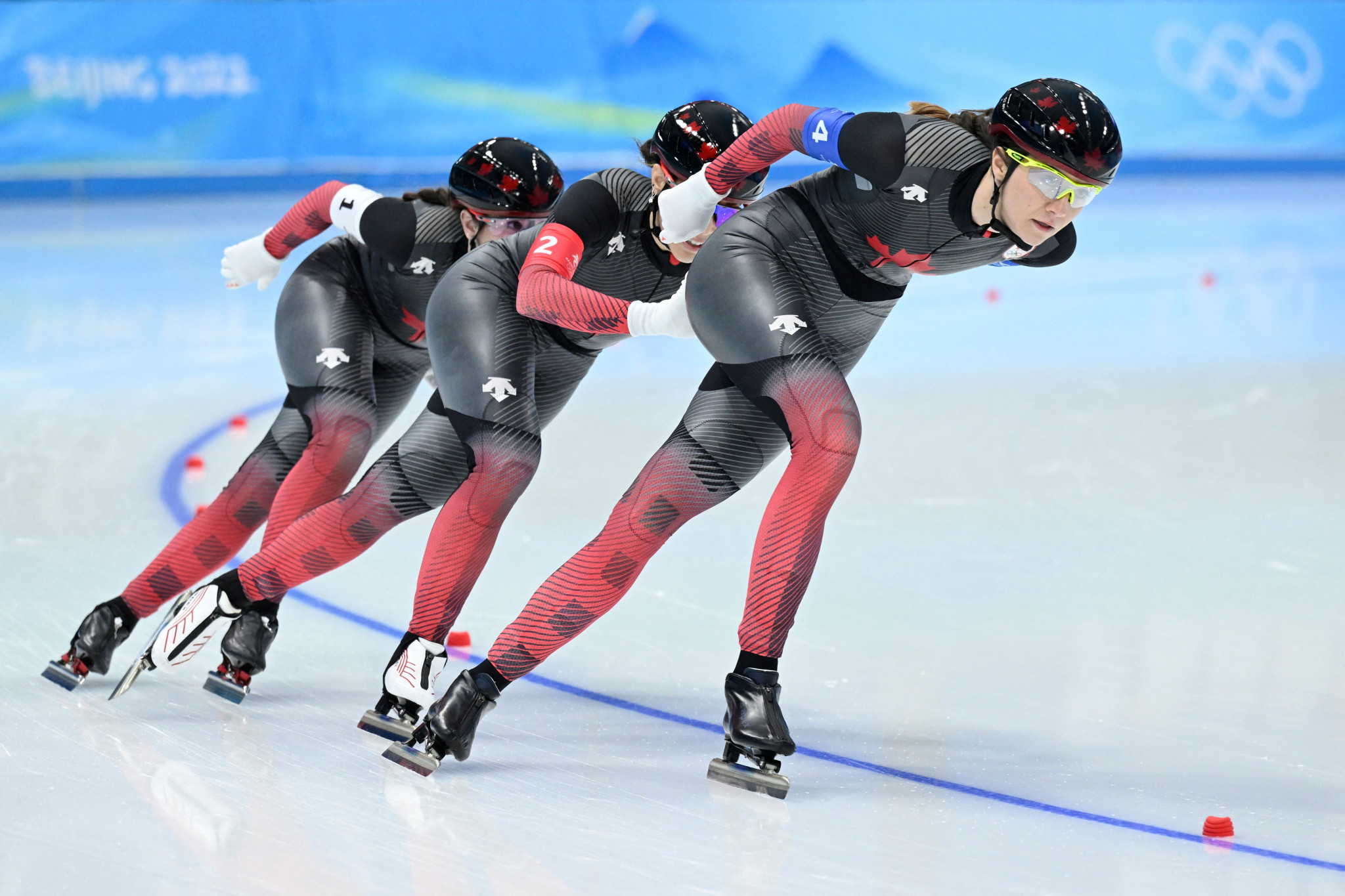 Ivanie Blondin, left, Valerie Maltais, centre, and Isabelle Weidemann, right, triumphed for Canada in the women's speed skating team pursuit ©Getty Images