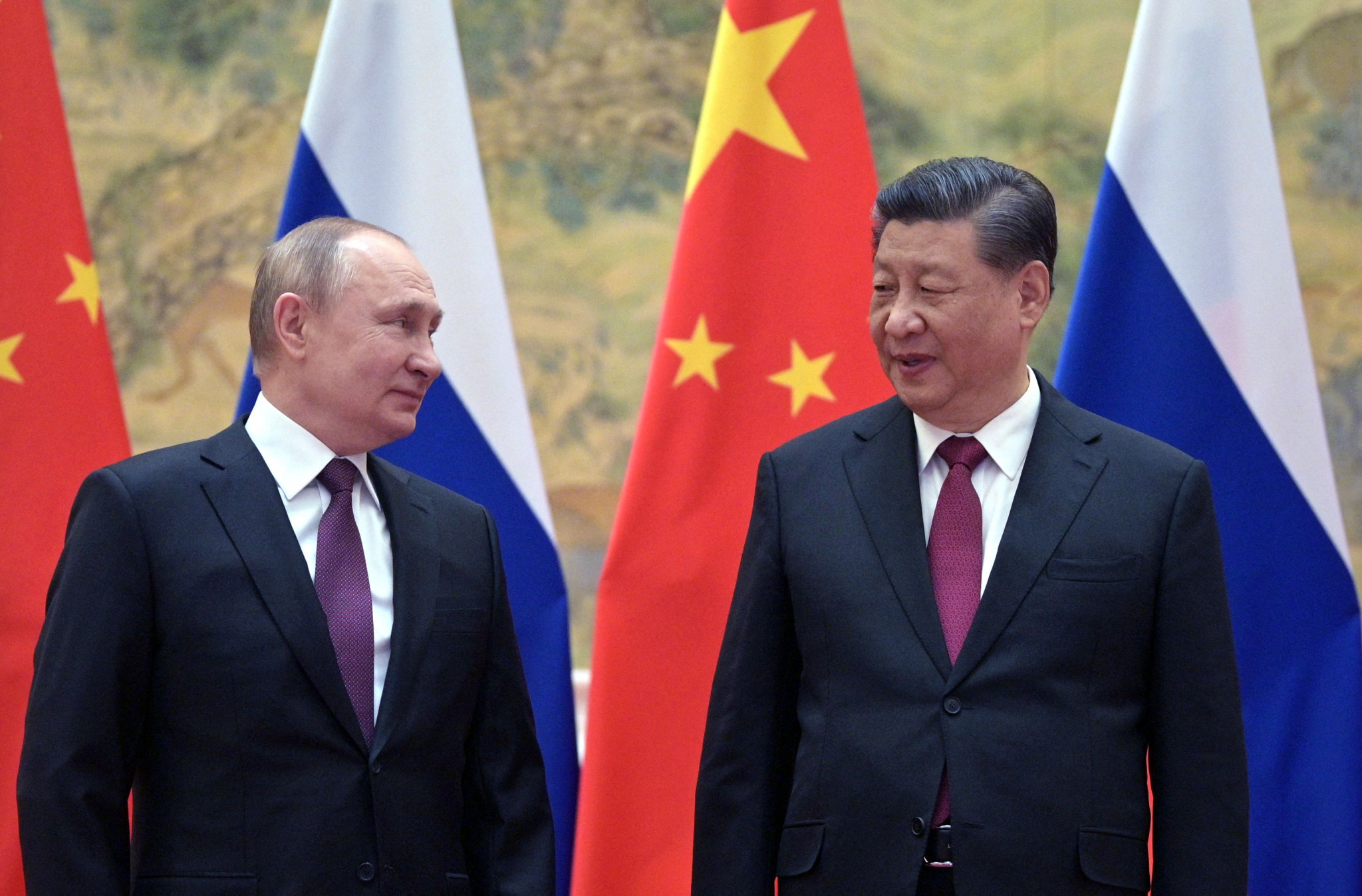 Russian President Vladimir Putin, left, was among foreign leaders who travelled to Beijing for the 2022 Winter Olympics and to meet Chinese leader Xi Jinping 