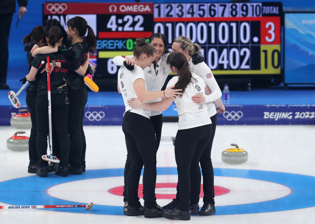Eve Muirhead, right, celebrates with her British team-mates after earning women's curling gold at the Beijing 2022 Winter Olympics with a 10-3 win over Japan ©Getty Images