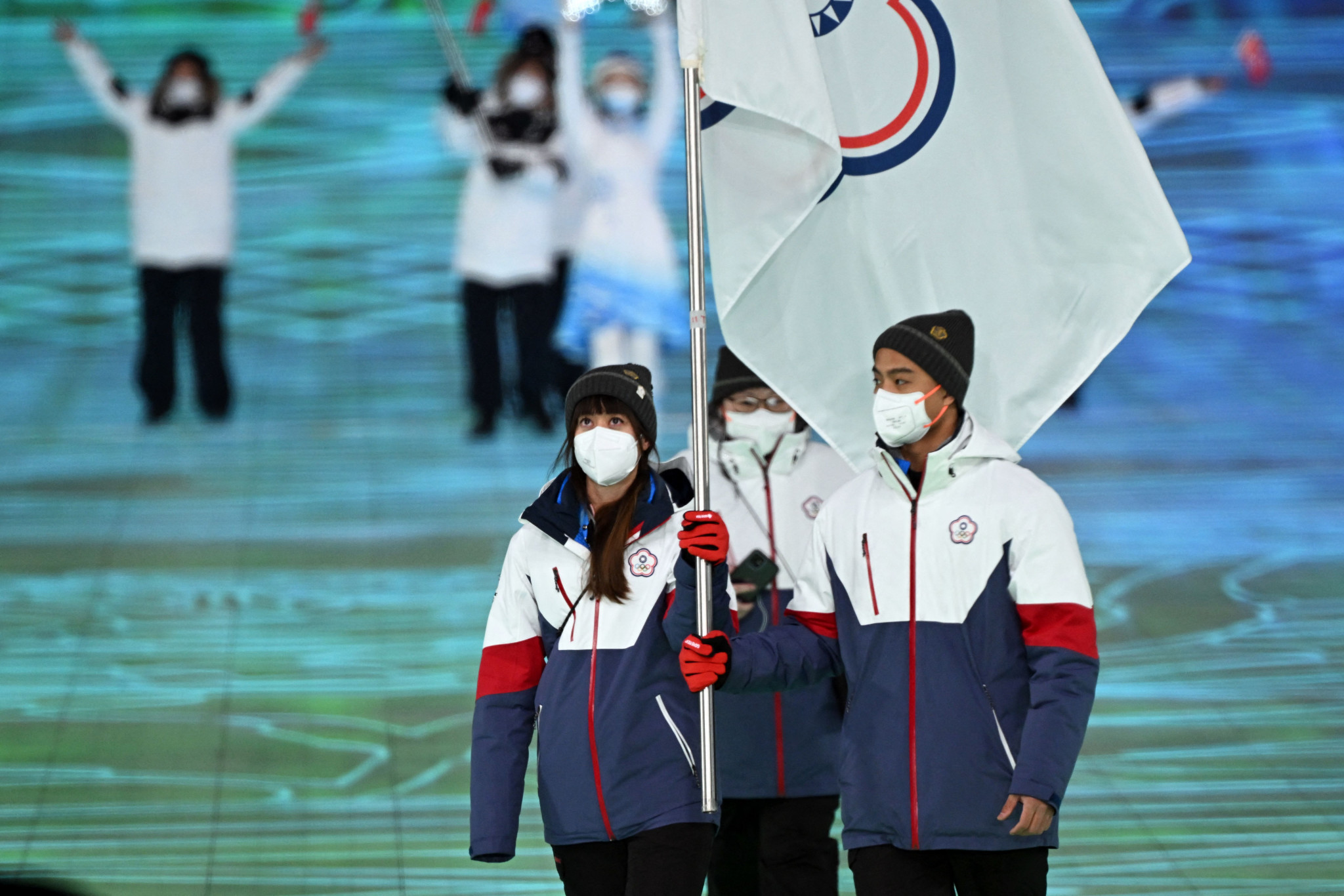 Huang Yu-ting, left, served as a flagbearer for Chinese Taipei at the Beijing 2022 Winter Olympics after its athletes had initially been set not to take part ©Getty Images