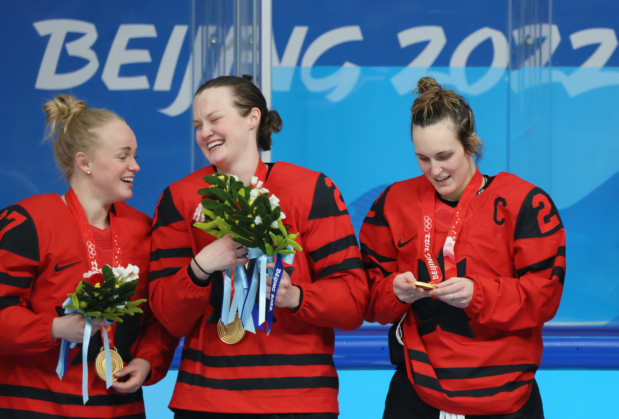 Micah Zandee-Hart, centre, receiving her gold medal with Emma Maltais, left, and Marie-Philip Poulin, right ©Getty Images