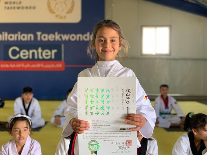 Youngest refugee to earn black belt receives official certificate