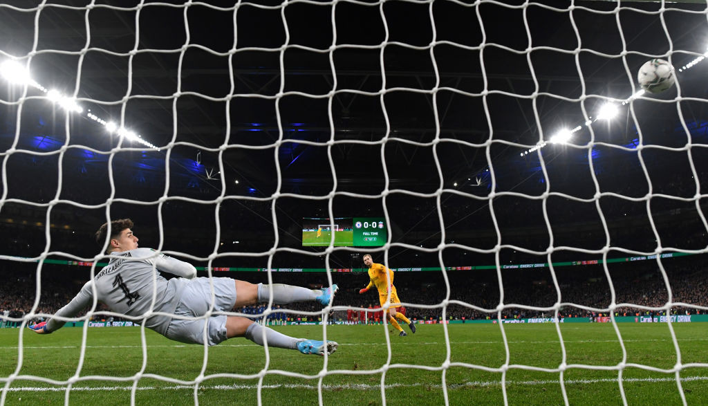 Liverpool keeper Caoimhín Kelleher scores the decisive penalty to earn his team the Carabao Cup by an 11-10 margin in the shootout ©Getty Images