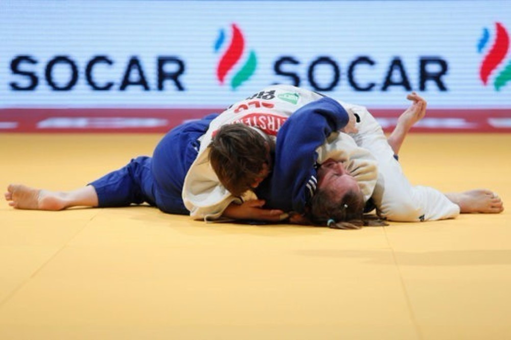 World champion Tina Trstenjak claim gold in the women's under 63kg class