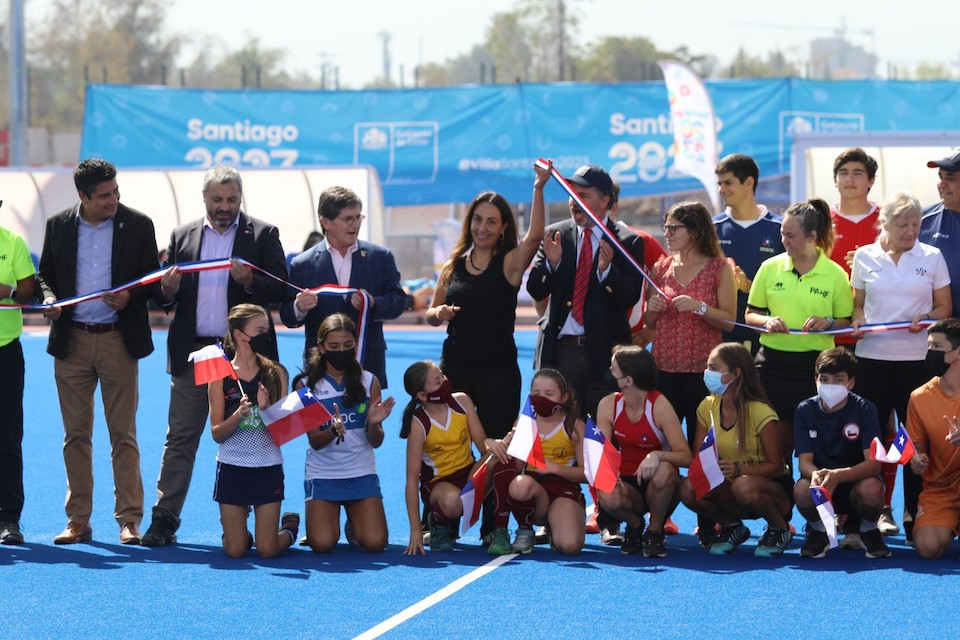 Chilean Sports Minister Cecilia Perez cuts the ribbon during the ceremony at the Field Hockey Training and Competition Centre located in the National Stadium Sports Park ©Panam Sports Organisation 