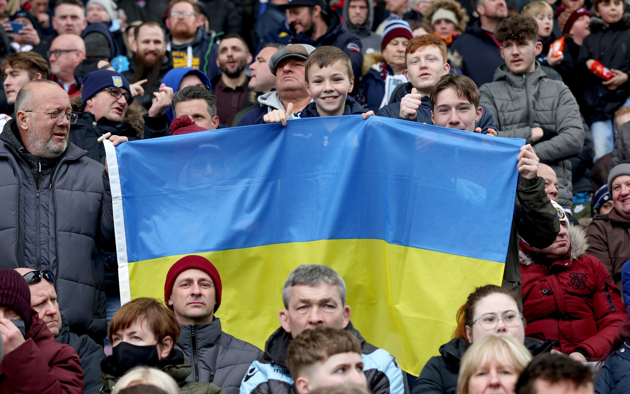 Aston Villa fans hold up a Ukraine flag before their side's match against Southampton ©Getty Images