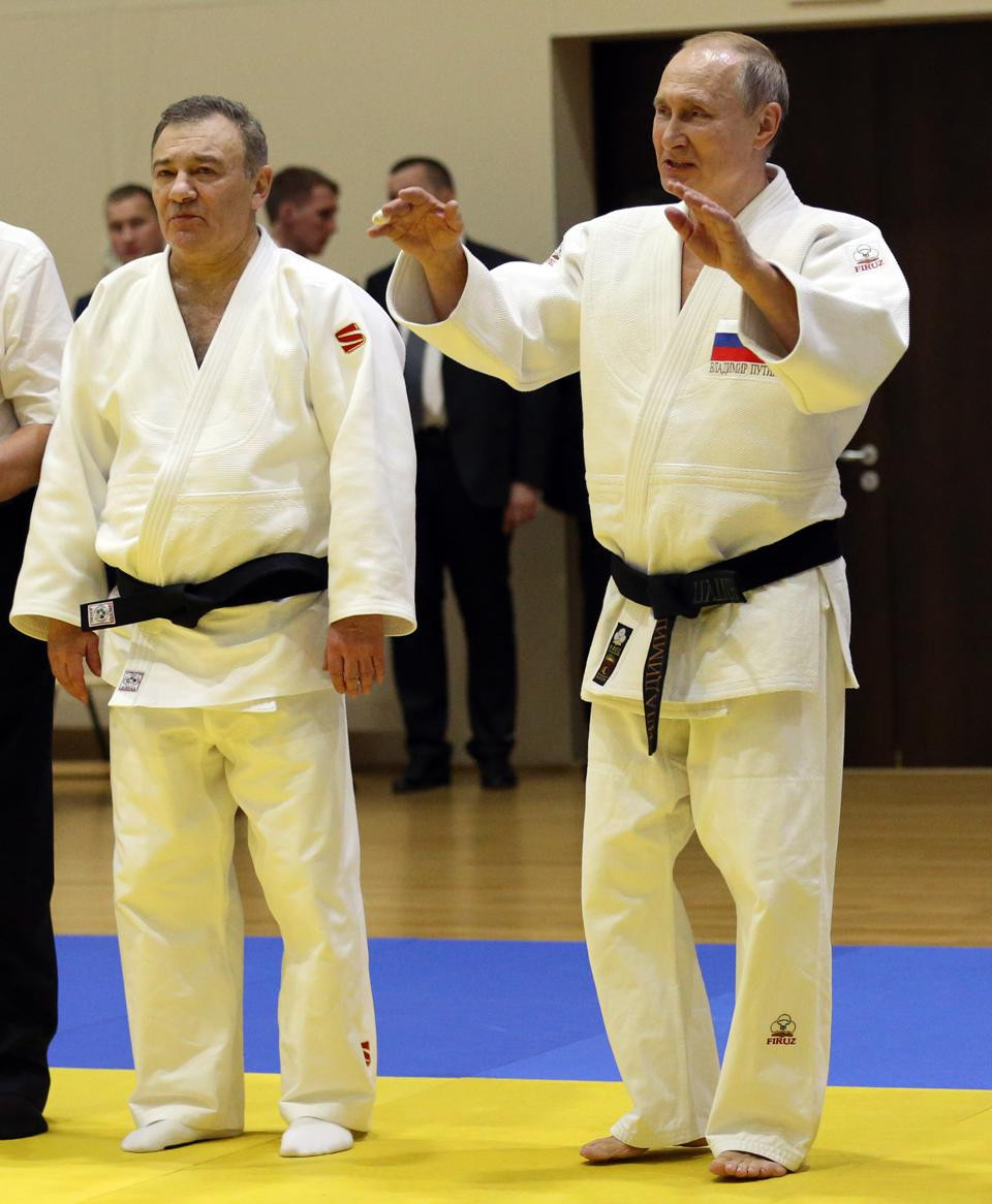 Russian billionaire businessman Arkady Rotenberg, left, was a judo training partner of Vladimir Putin, right, and a member of the IJF  Executive Committee before being removed today ©Getty Images