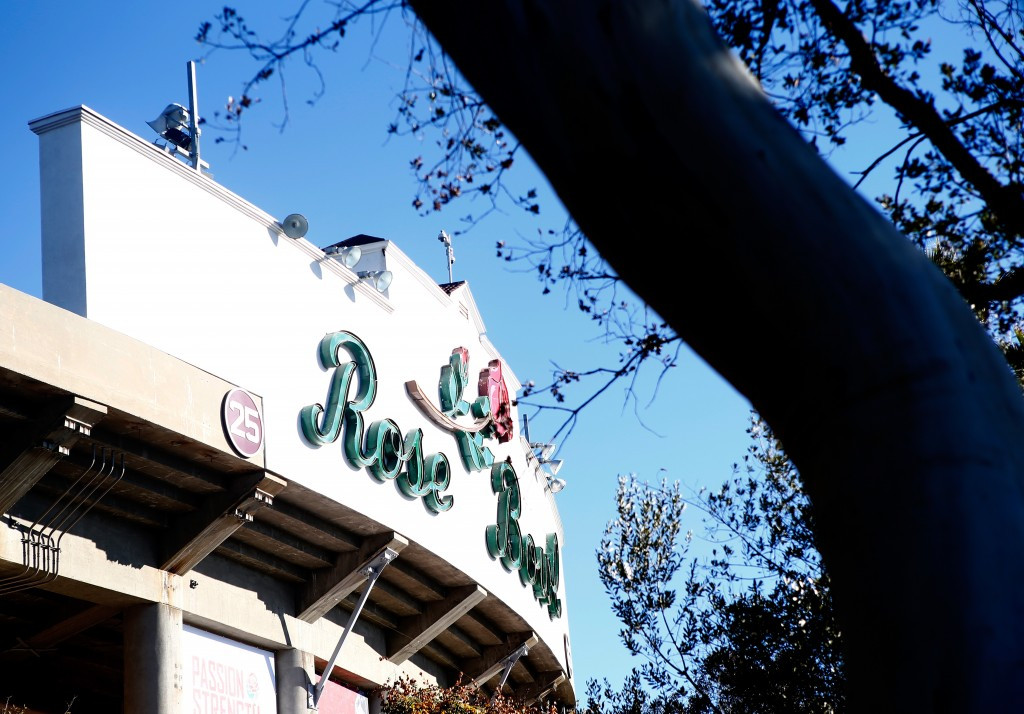 The use of existing venues, such as the Rose Bowl in Los Angeles, is seen as key