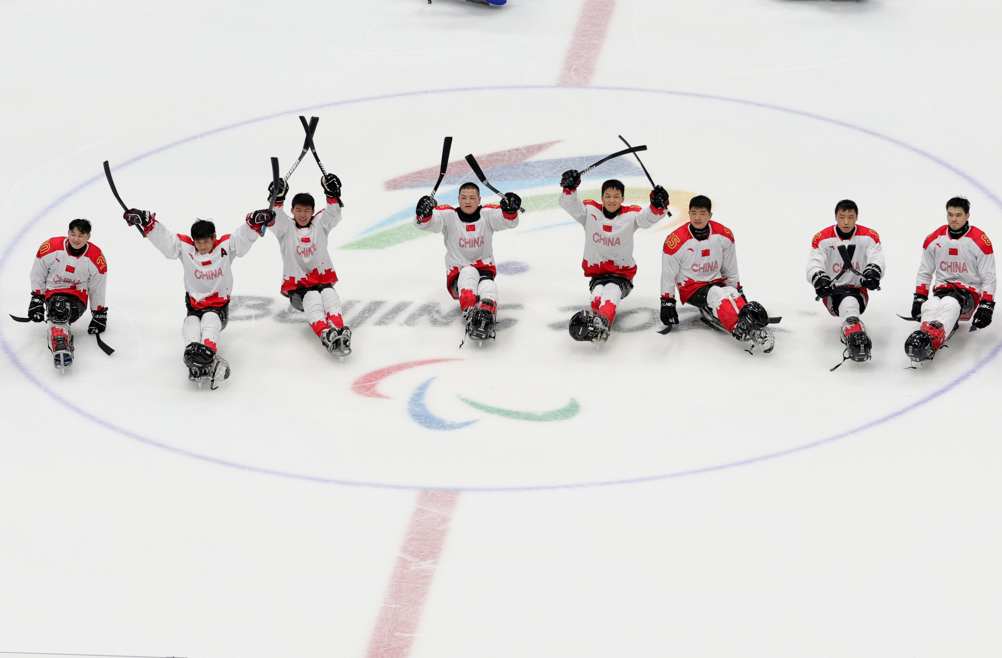 China celebrate after winning three matches out of three in the preliminary round of the ice hockey at the Beijing 2022 Winter Paralympics ©Getty Images