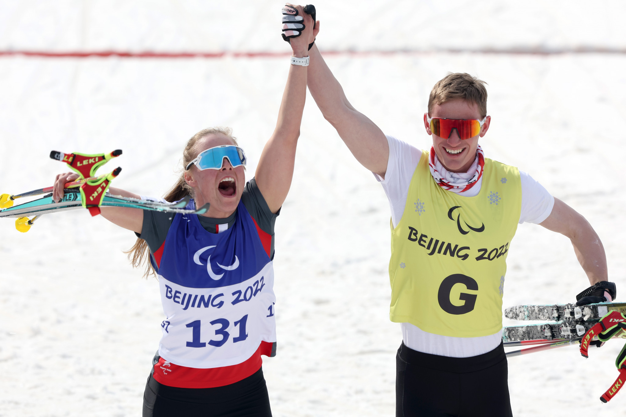 Carina Edlinger celebrates with guide Lorenz Josef Lampl after winning women's sprint free technique vision impaired gold ©Getty Images