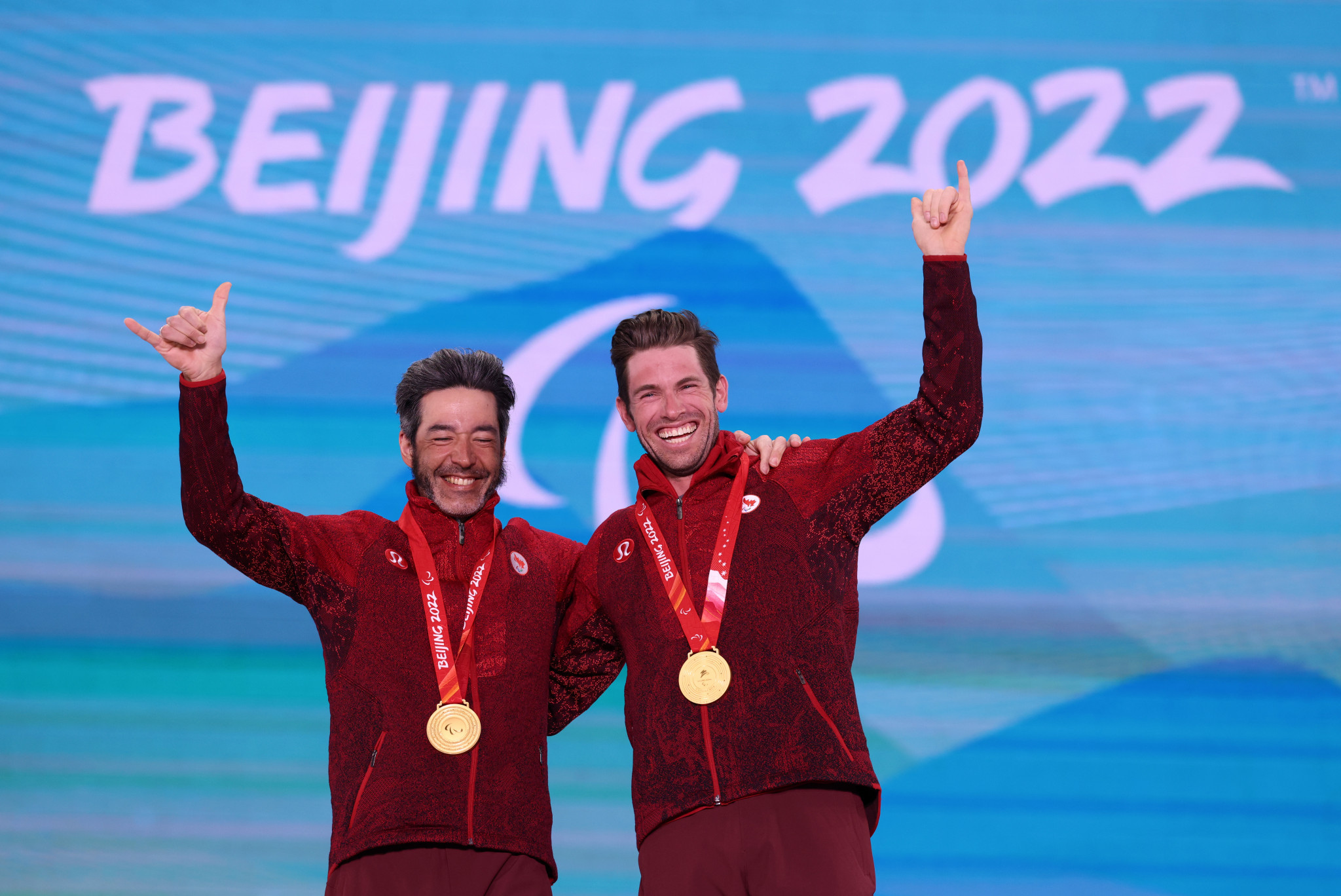 Brian McKeever, left, won his 15th Paralympic gold medal in the Beijing 2022 men's vision impaired cross-country sprint ©Getty Images
