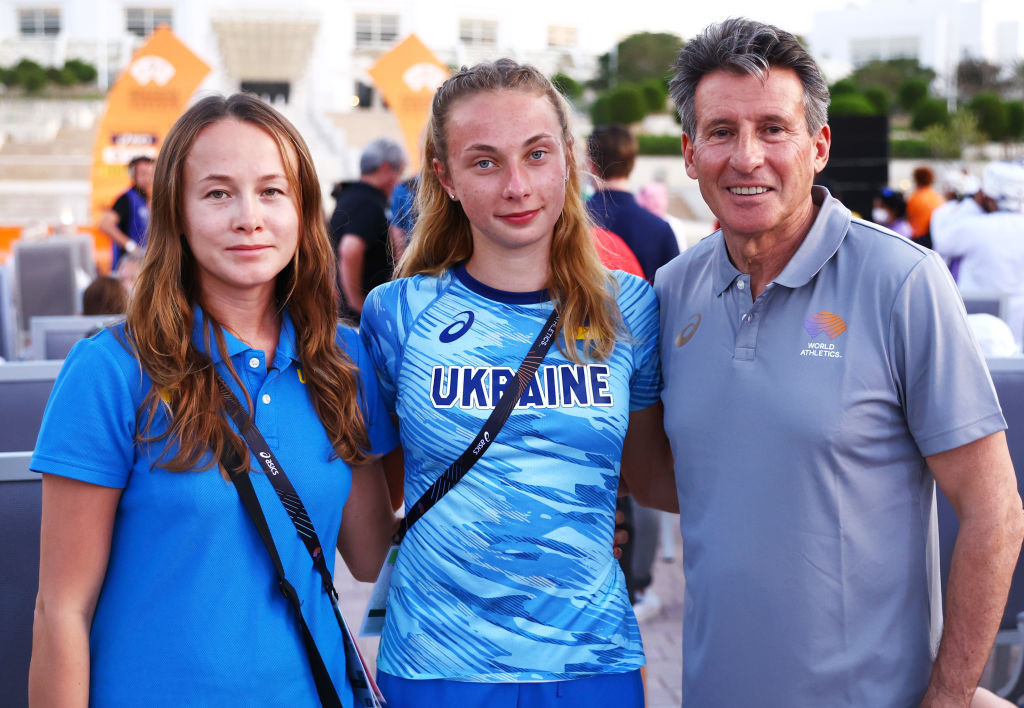 World Athletics President Sebastian Coe, pictured with Valeriya Sholomitska of Ukraine and her coach Olena Borysiuk at the recent World Race Walking Team Championships in Muscat, will be involved in further discussions of the Ukraine crisis during tomorrow's second day of the World Athletics Council meeting ©Getty Images