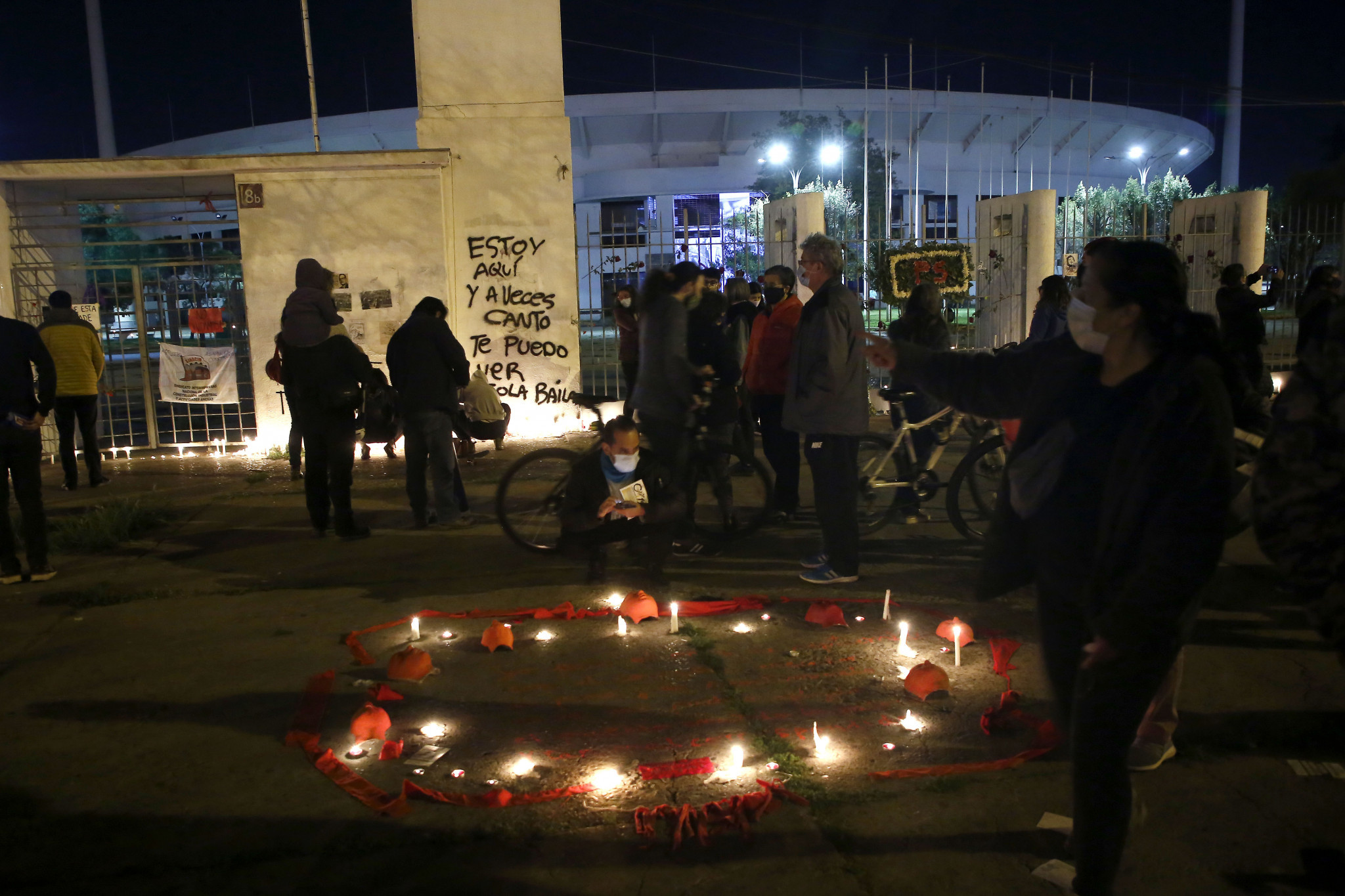 Candles are lit outside the National Stadium in Santiago to remember the victims of the Pinochet regime ©Getty Images