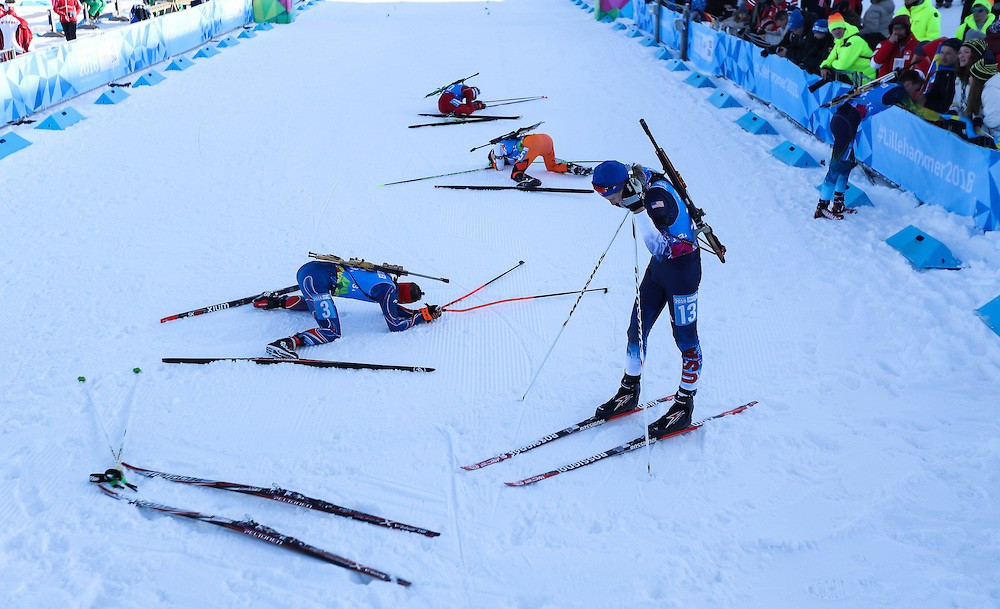 The biathletes collapsed with exhaustion following the conclusion of the mixed team relay event ©YIS/IOC