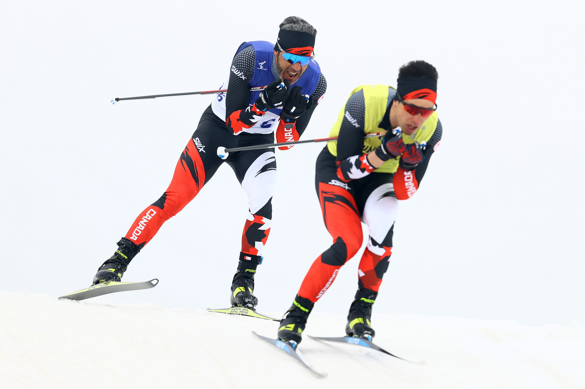 Canada's Brian McKeever, left, secured his third gold of Beijing 2022 in the men's middle distance free technique vision impaired ©Getty Images