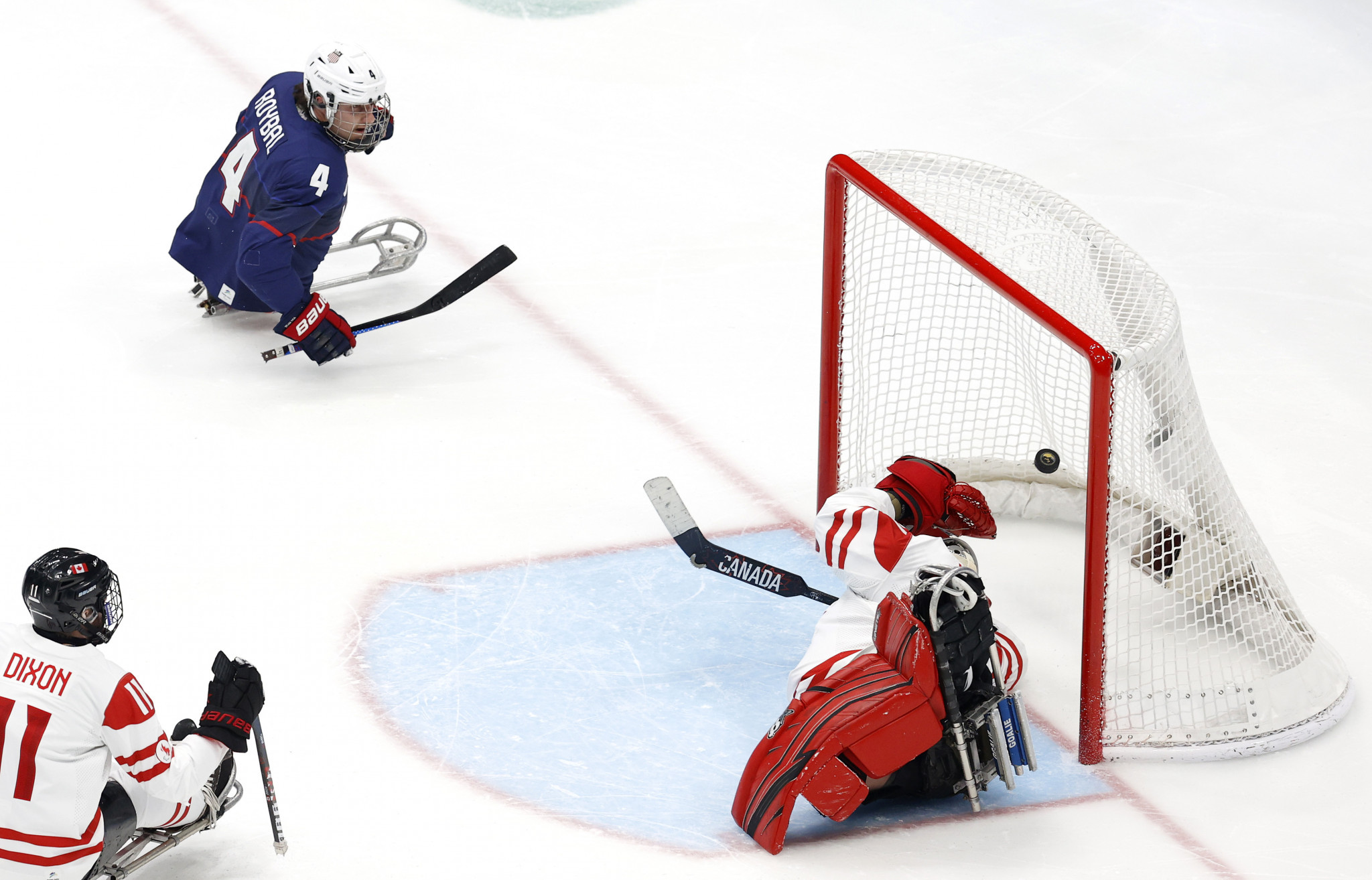 Dominic Larocque, right, made a catastrophic mistake to allow Brody Roybal, blue, to score the United States' second goal ©Getty Images