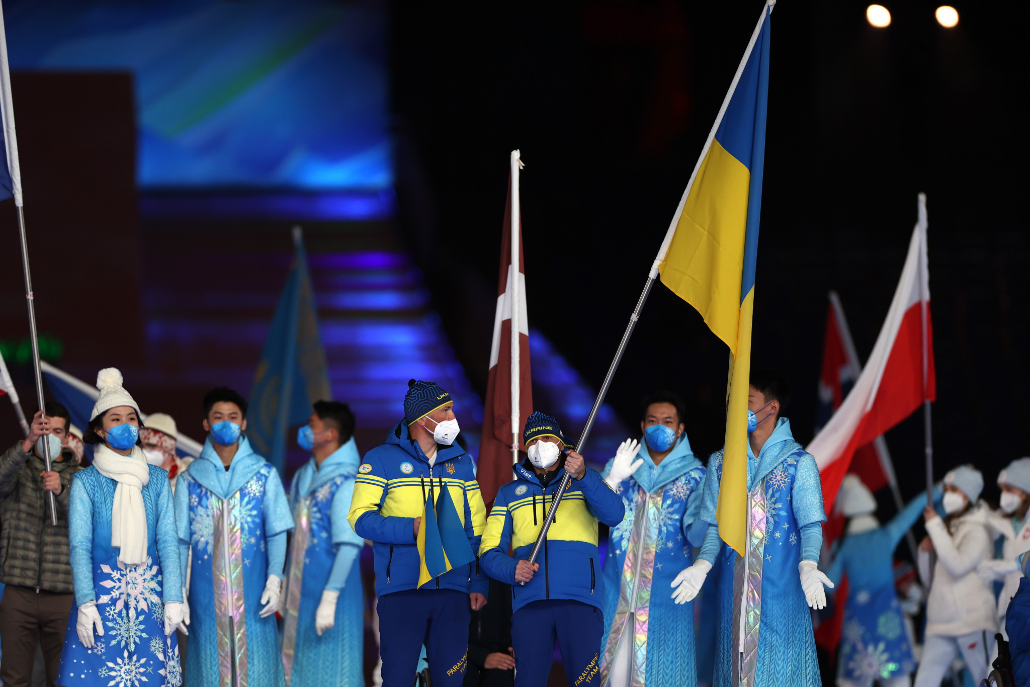 Ukrainian biathlete Vitalii Lukianenko, who achieved two golds and one silver at Beijing 2022, carried his nation's flag ©Getty Images