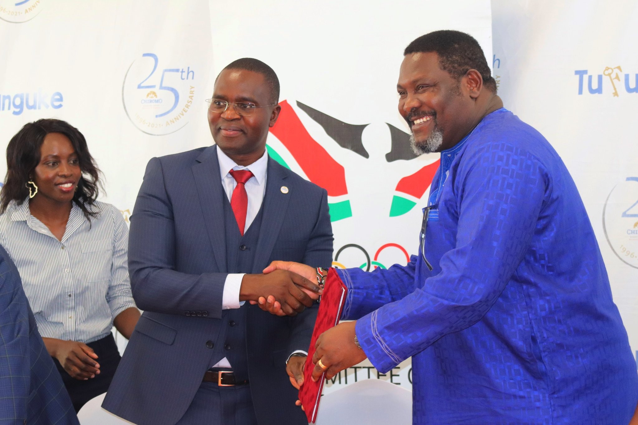 Chiromo Hospital Group chief executive Vincent Hongo, left, and Kenyan Olympic Committee Deputy President Shadrack Maluki celebrate their agreement ©NOC-K