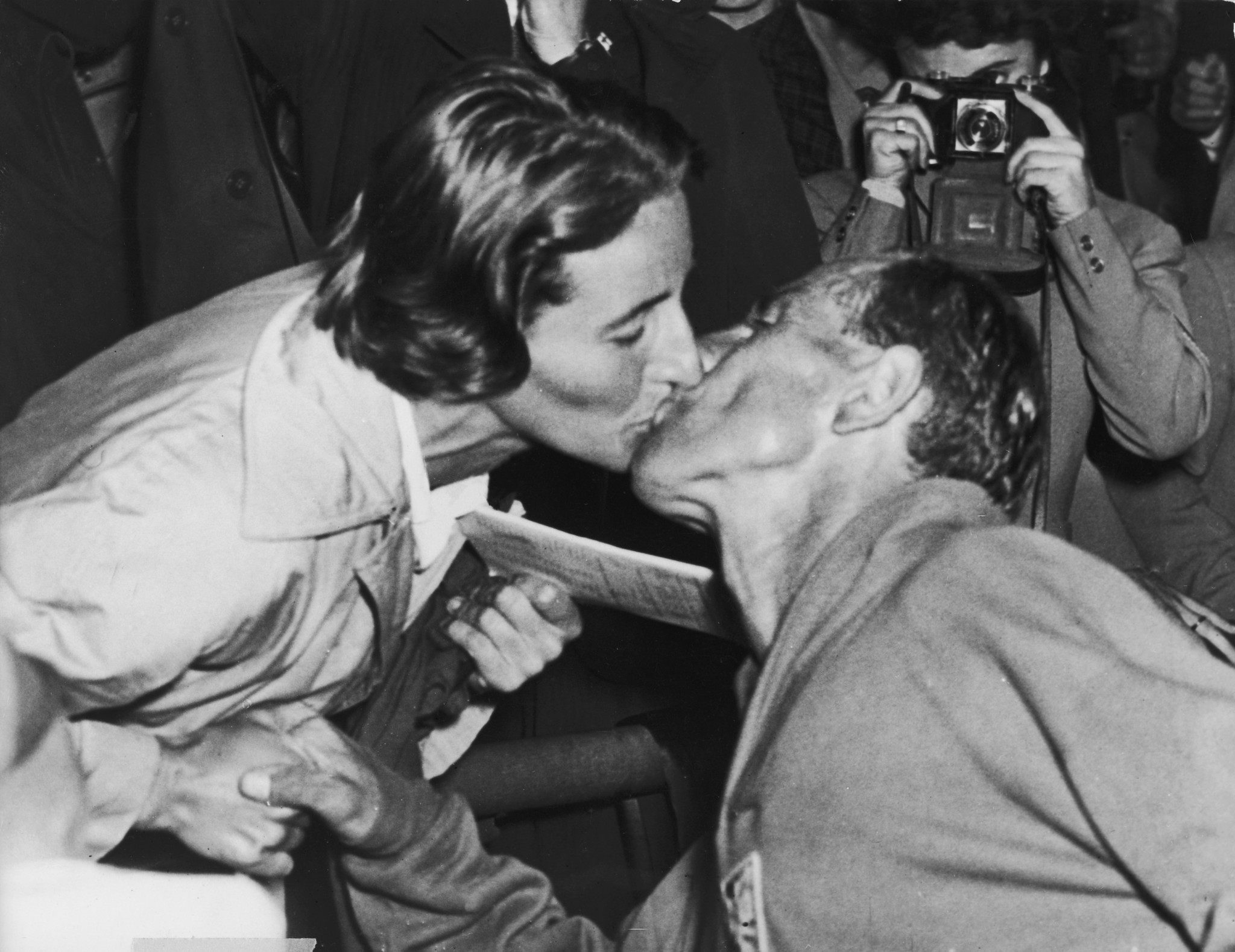 Emil Zatopek's wife Dana, winner of the Olympic javelin at Helsinki 1952, congratulates her husband after he had won his third gold medal in the marathon ©Getty Images
