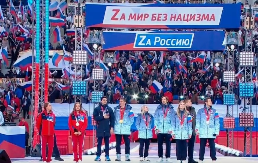 Gymnasts Dina and Arina Averina and four Russian figure skaters appeared on stage at the Luzhniki Stadium in Moscow to show their support for Russian President Vladimir Putin and his invasion of Ukraine ©YouTube