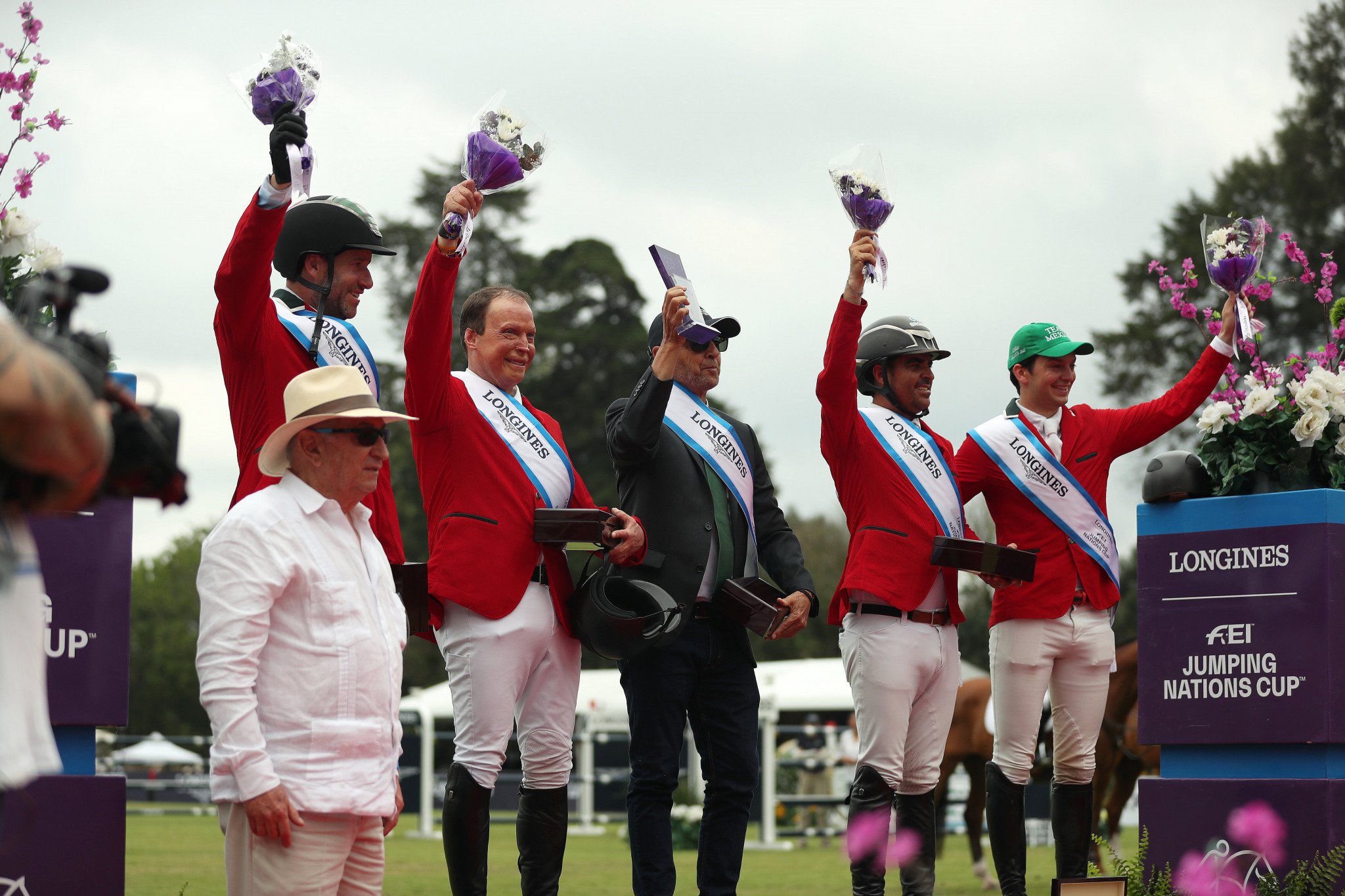 The winning team from Mexico celebrates its victory on the podium at the FEI Jumping Nations Cup 2022 in Coapexpan ©FEI