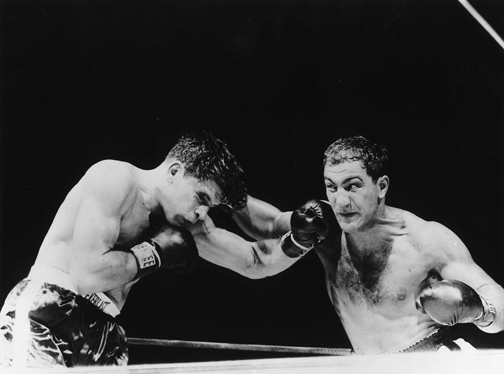 Rocky Marciano, right, became the only world heavyweight boxing champion to retire unbeaten in 1956 after a sequence of 49 victories ©Getty Images
