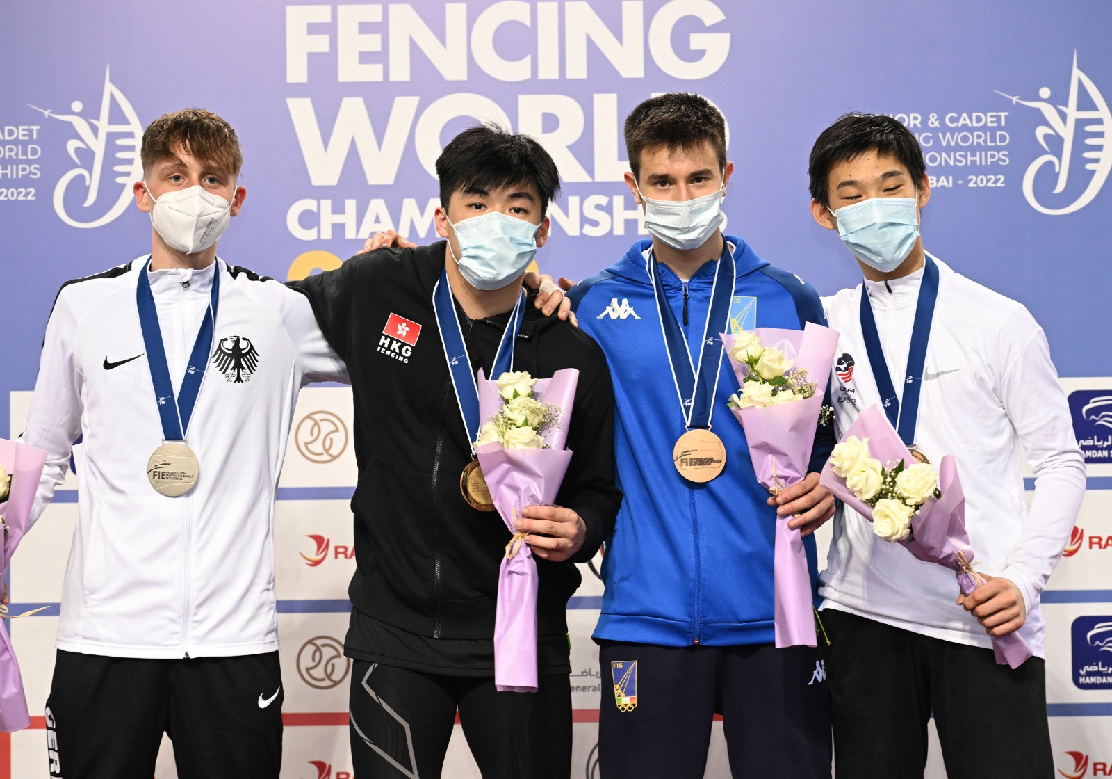 Cheng Tit Nam (black) produced a dominant performance to win the men's cadet foil final ©FIE