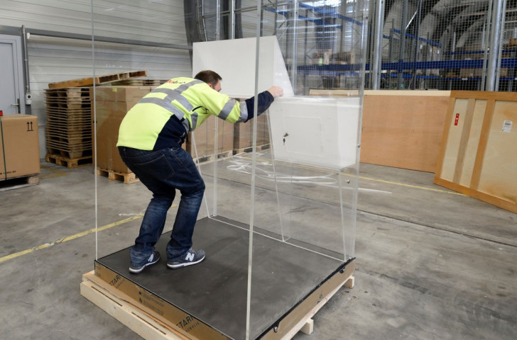 One of the transparent voting booths provided for the FIFA Presidential vote by candidate Prince Ali Bin Al Hussein being set up at Zurich Airport. FIFA apparently saw through this gambit and chose to keep the voting procedure opaque ©Getty Images