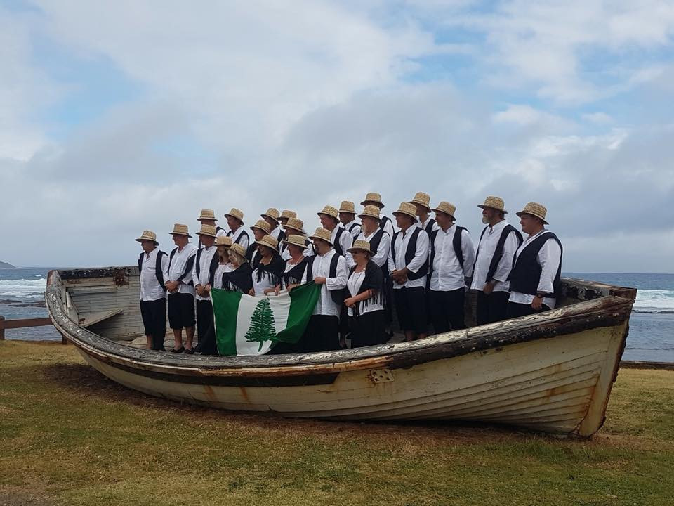 The Norfolk Island team before Gold Coast 2018, in a whaling boat and wearing bounty hats ©NICGA