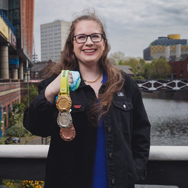 Medal ribbon designer Francesca Wilcox pictured with the medals ©Lensi Photography