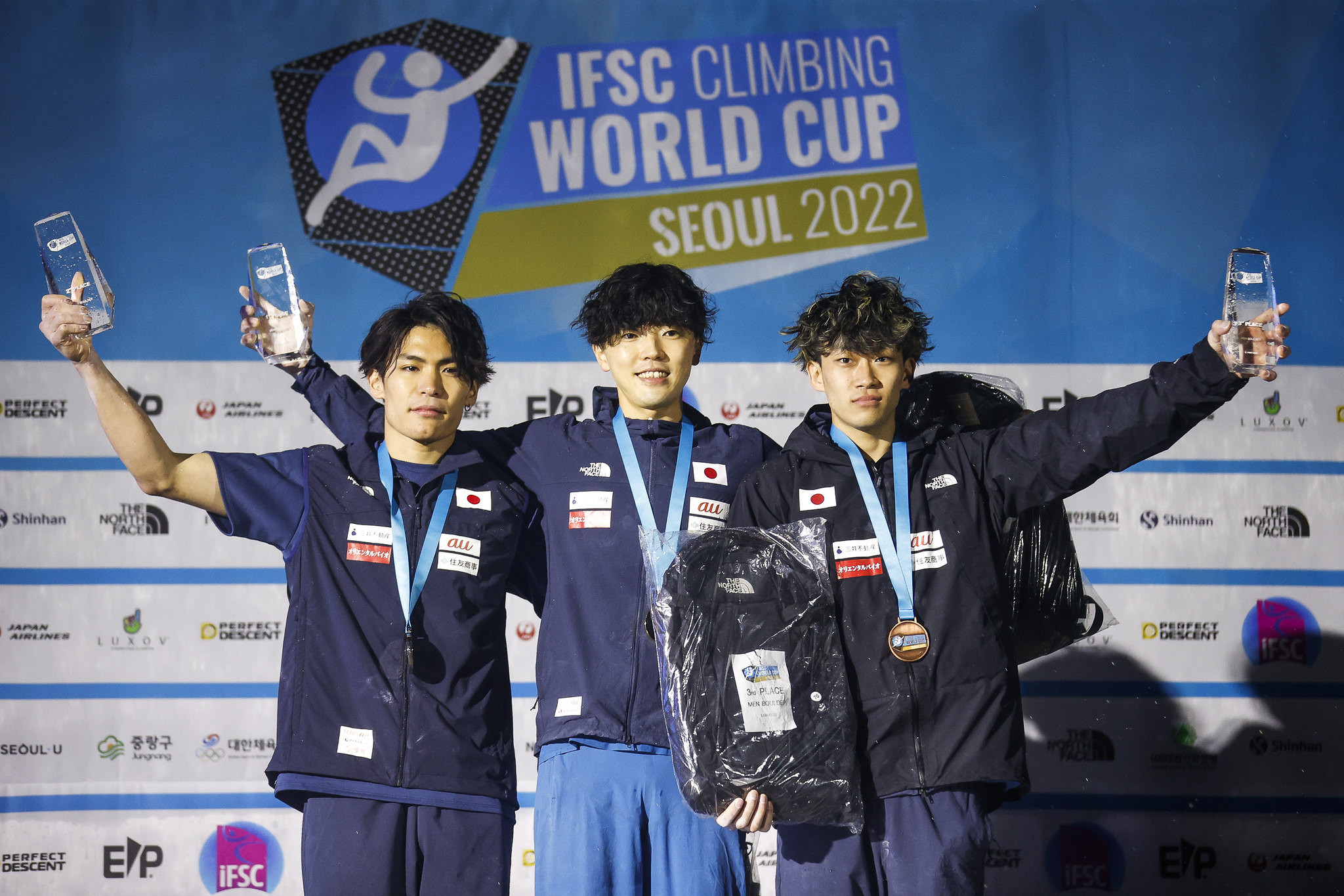 Kokoro Fujii, centre, led an all-Japanese men's boulder podium ©Dimitris Tosidis/IFSC