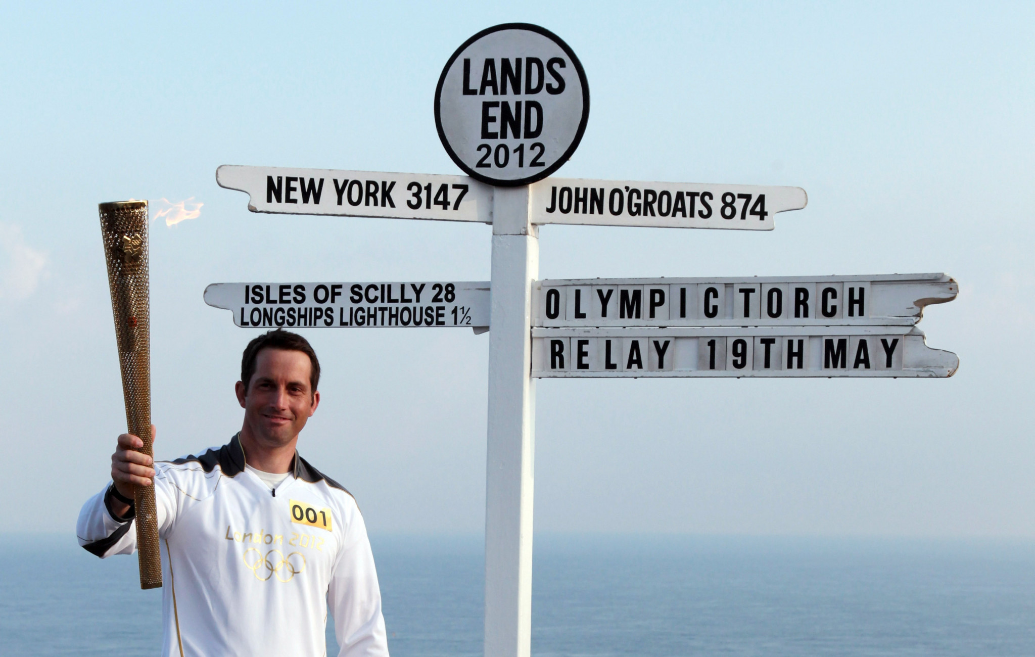 Legendary Olympic sailor Sir Ben Ainslie was the first London 2012 Torch Bearer on British soil at Land's End ©Getty Images