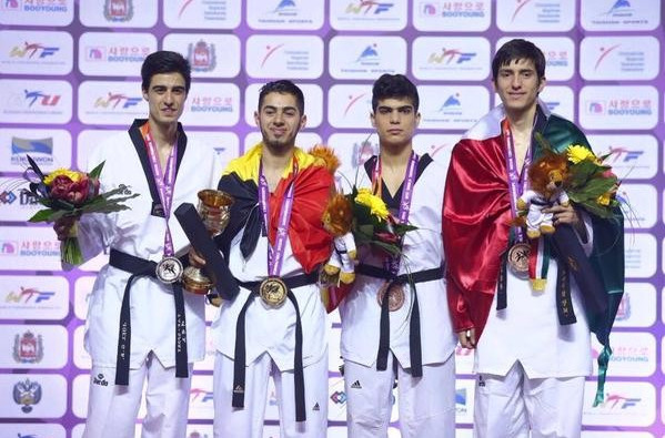 Jaouad Achab (second left) was wrapped in the Belgium despite winning under 63kg gold as an independent athlete at last week's World Championships ©WTF