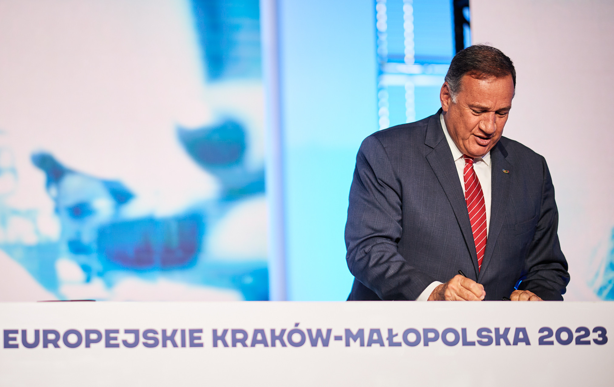 EOC President Spyros Capralos put pen to paper to confirm Kraków-Małopolska as host for next year's European Games ©EOC