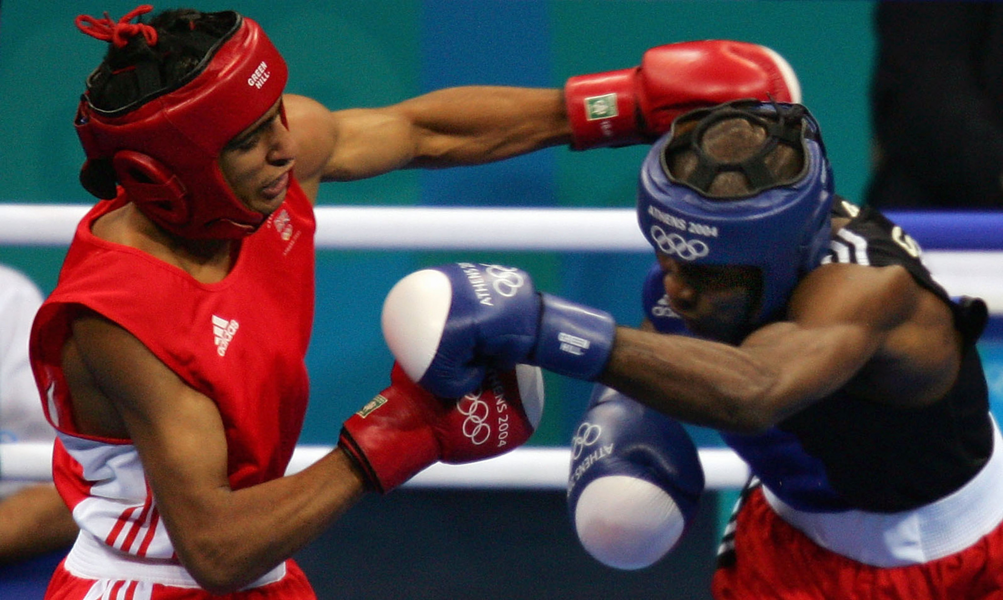 Amir Khan, left, won lightweight silver at the Athens 2004 Olympics, being defeated in the gold medal match by Cuban Mario Kindelan ©Getty Images