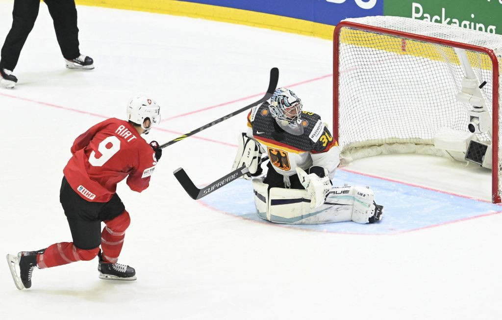 Damien Riat scores for Switzerland in the penalty shootout against Germany that earned a win which left them top of their IIHF World Championship qualifying group ©Getty Images
