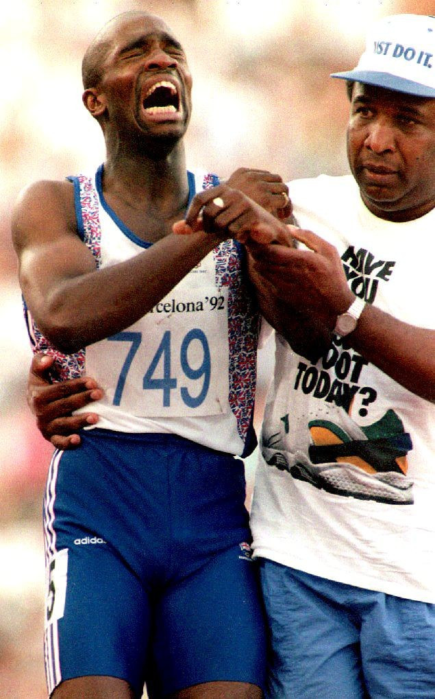 Derek Redmond being helped across the line by his father at Barcelona 1992 ©Getty Images