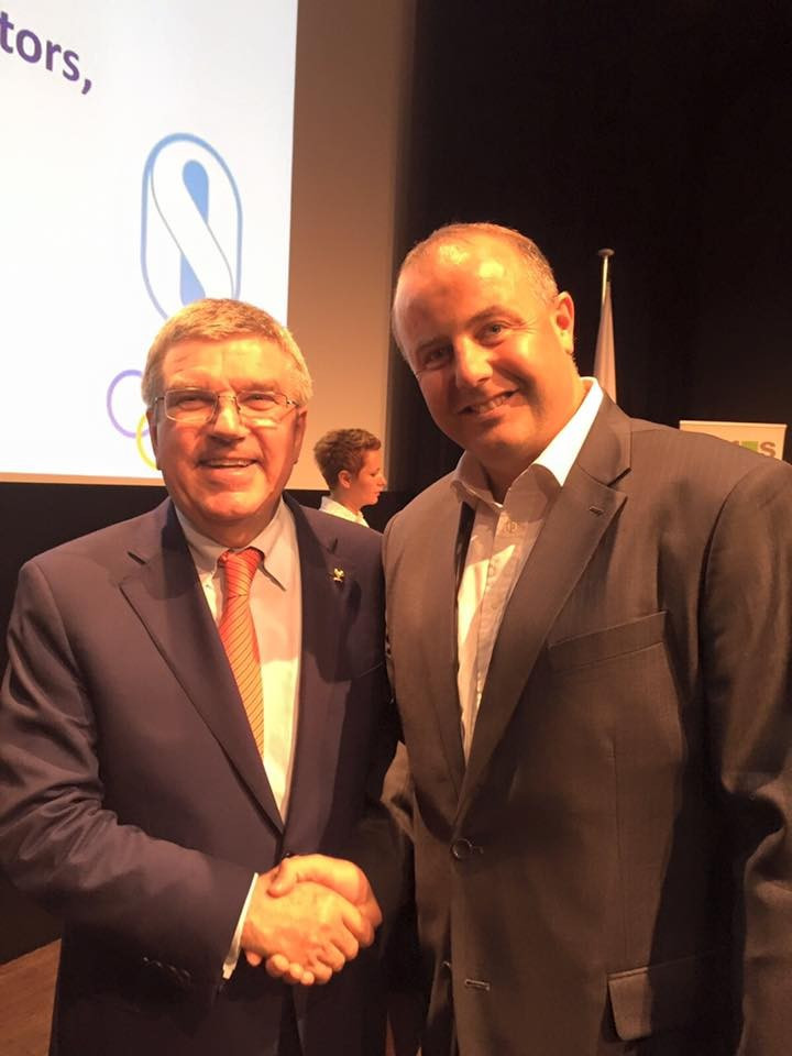 Pierce O'Callaghan with International Olympic Committee President Thomas Bach ©Facebook
