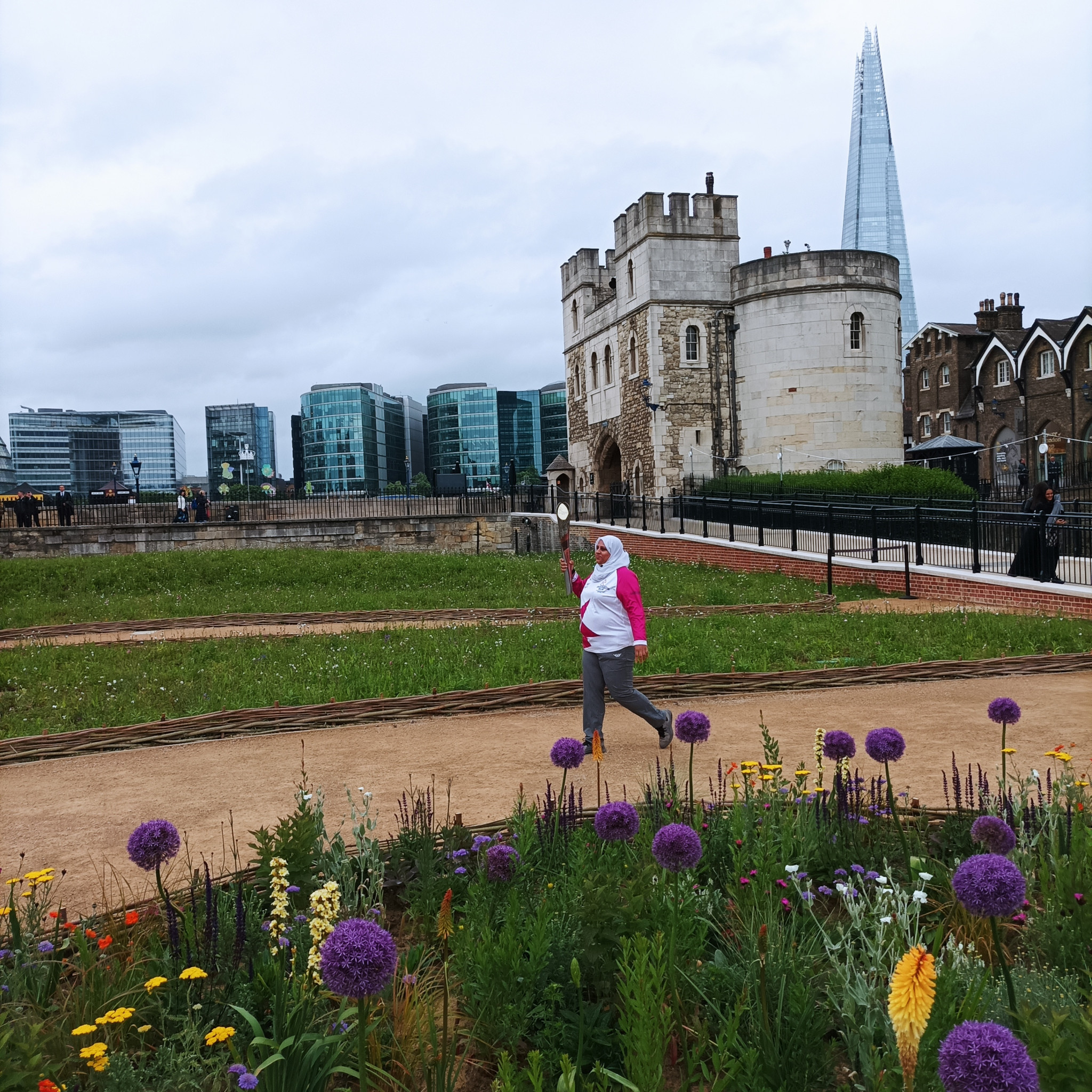 The walls of the Tower of London and the Shard provide a backdrop of contrasts as the Queen's Baton continued its journey ©ITG