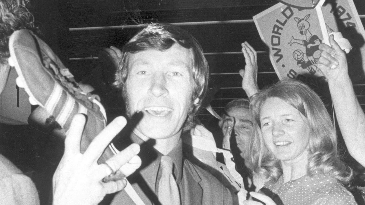 Jimmy Mackay waves the boot that scored the goal that qualified the Socceroos for the 1974 FIFA World Cup for the first time upon his arrival back in Australia ©Duncan Mackay