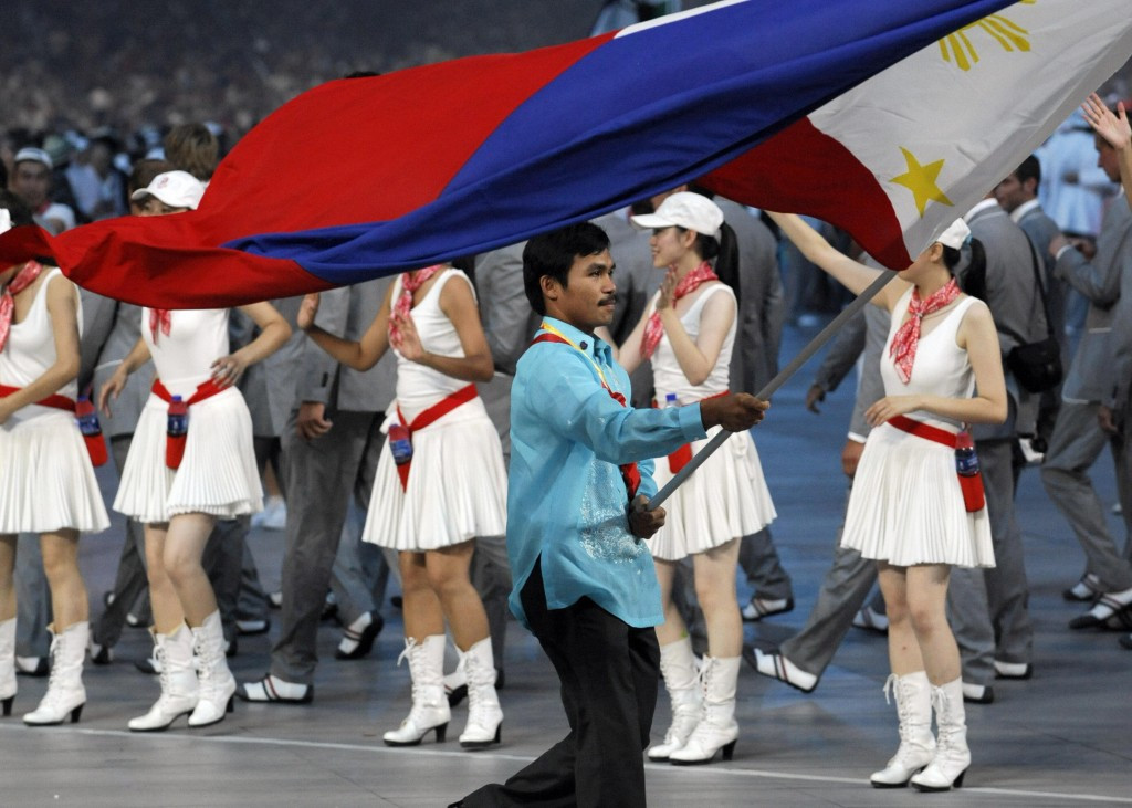 Manny Pacquiao did not compete in the Olympics during his amateur career but carried the  Philippines flag at the Opening Ceremony of Beiing 2008 ©Getty Images