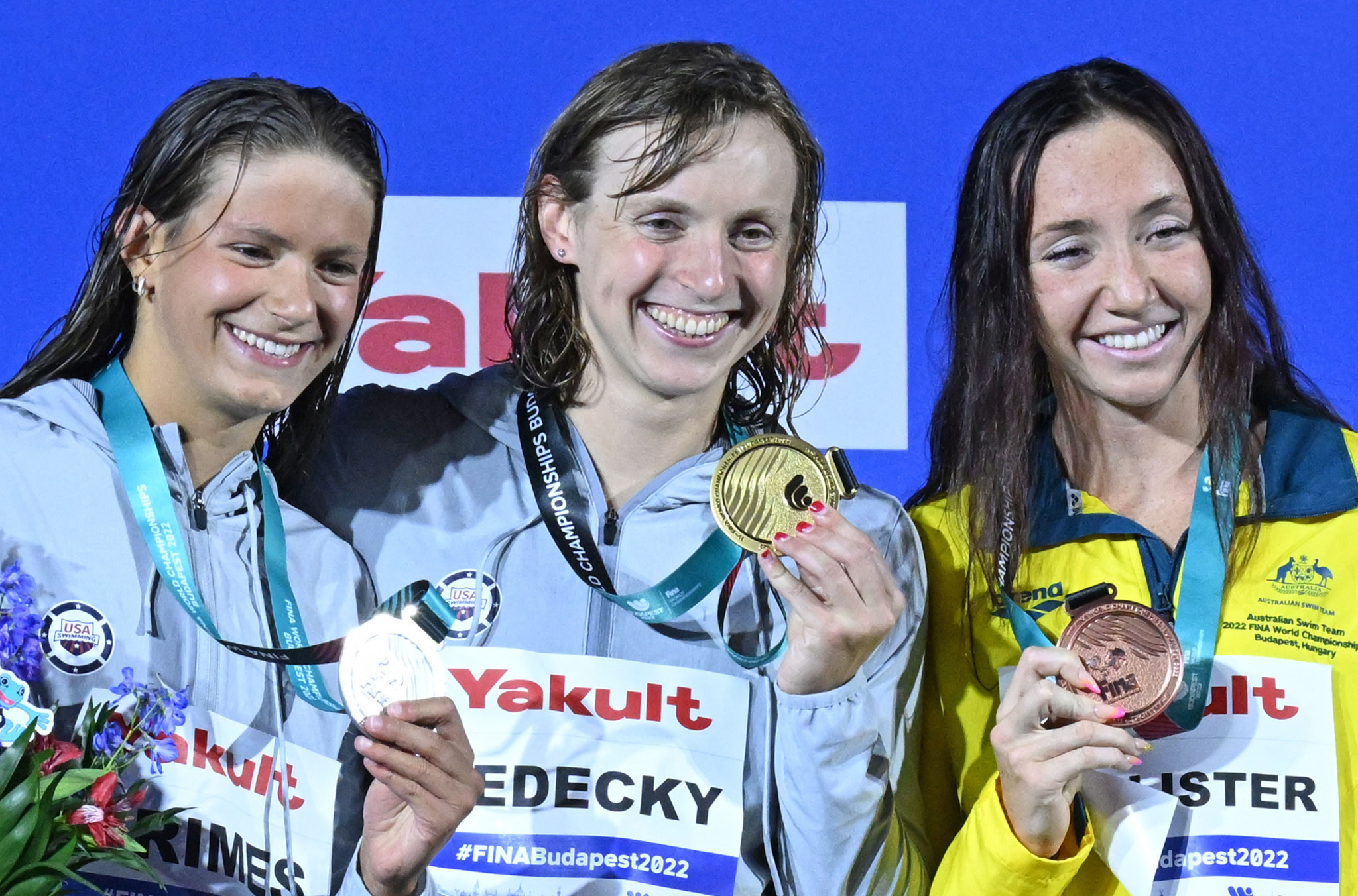 Katie Ledecky of the United States, centre, dominated the women's 1,500m freestyle to win her 17th World Championships medal, with compatriot Katie Grimes, left, and Australia's Lani Pallister, right, earning their first medals on this stage ©Getty Images
