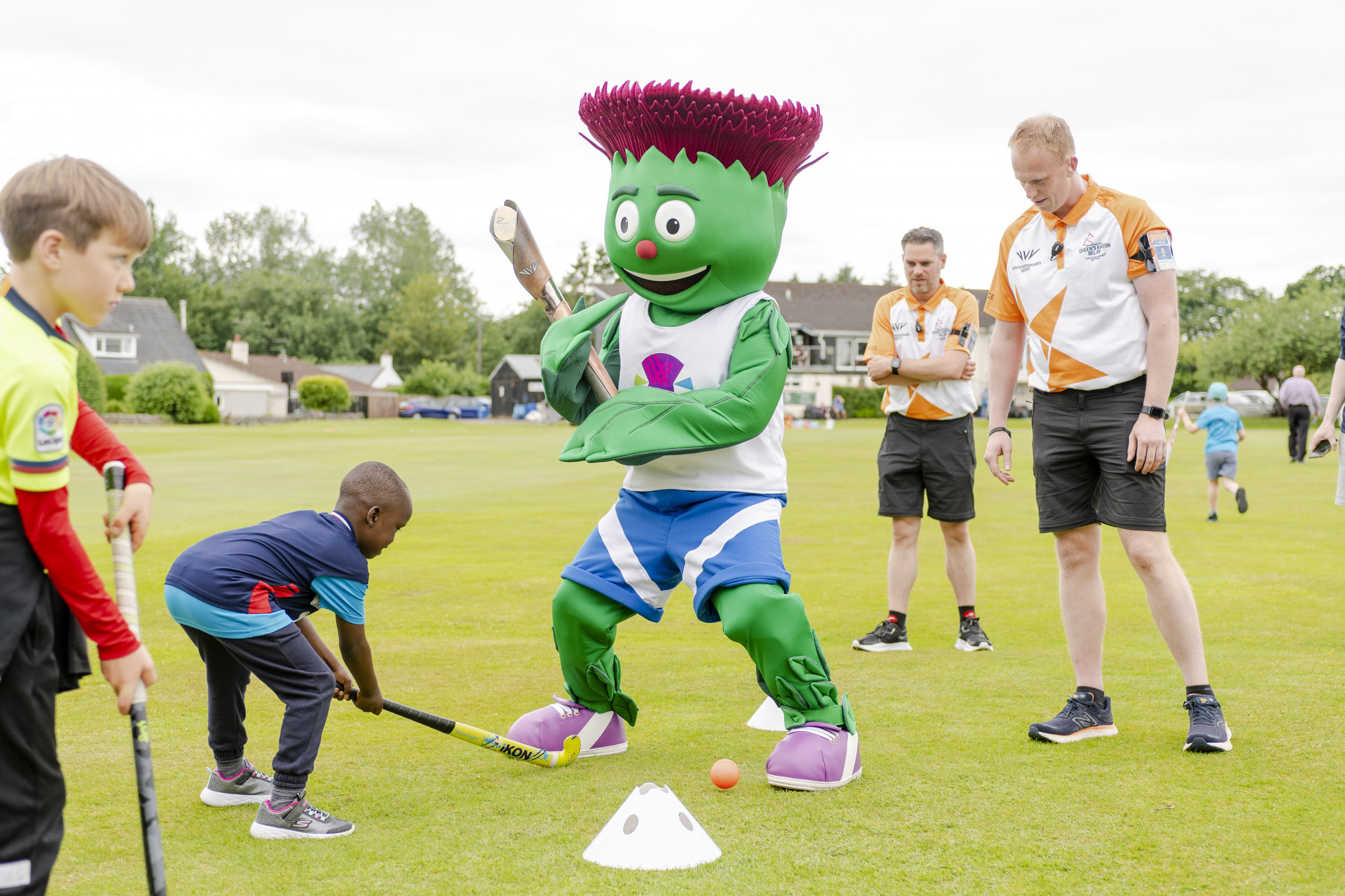Mascot Clyde tries out hockey during the progress of the Queen's Baton through Dumfries ©Getty Images