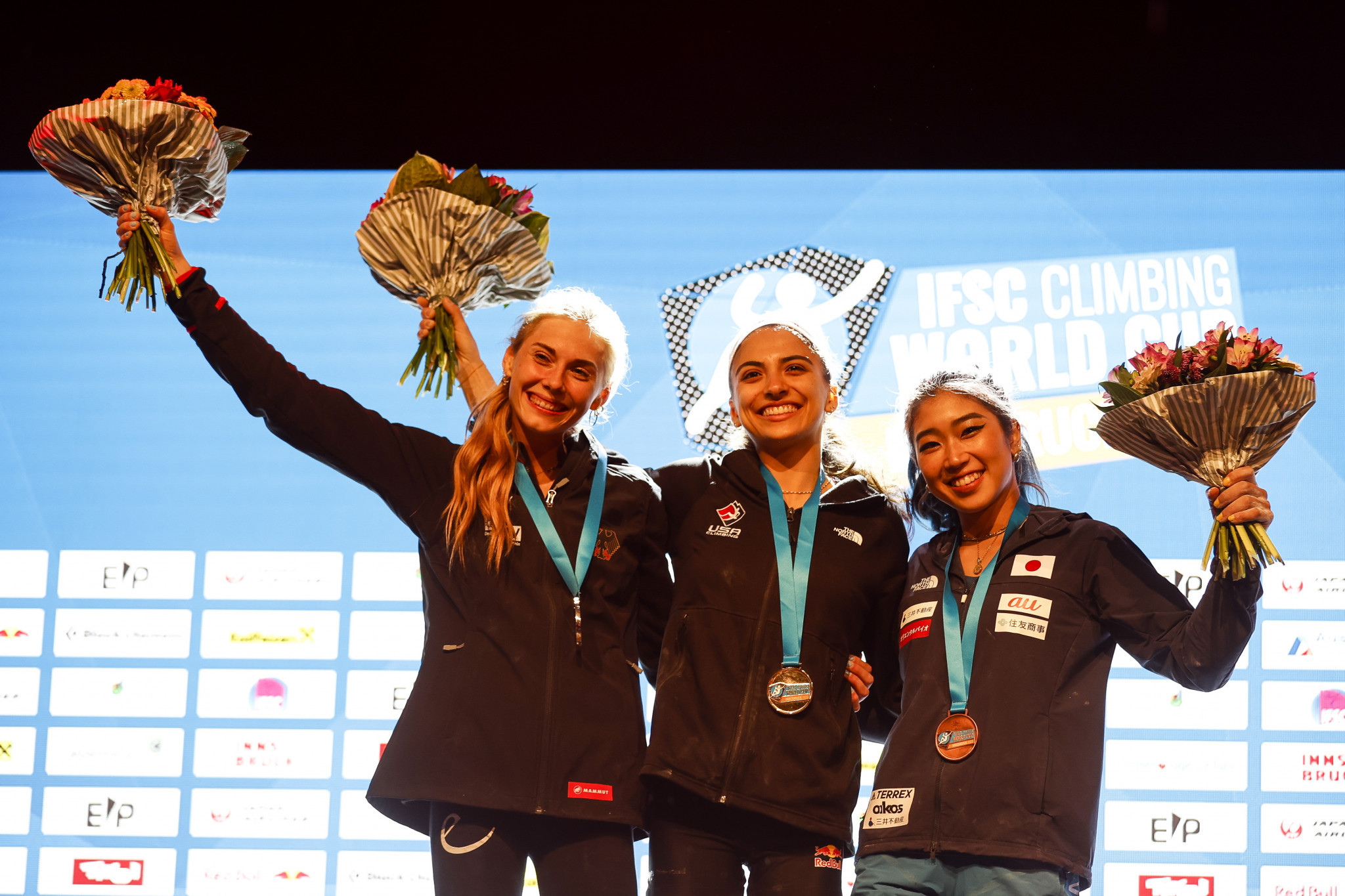 Natalia Grossman, centre, became the overall women's Boulder World Cup champion after her victory in Innsbruck ©Dimitris Tosidis/IFSC