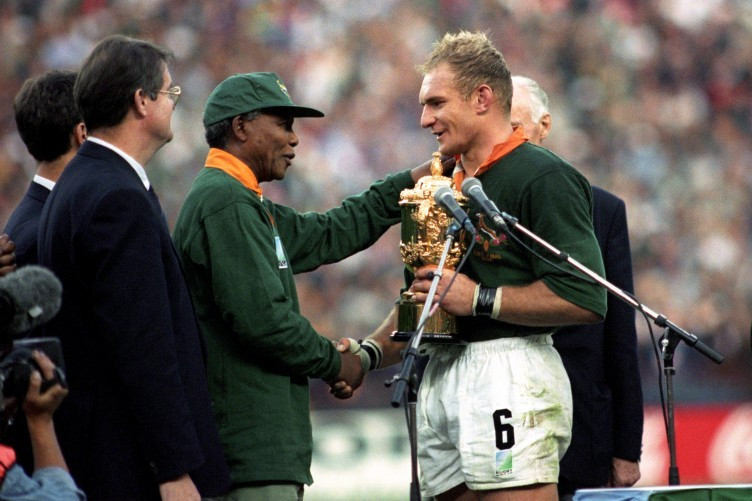 Bernard Lapasset, left, had previously been head of the sport's governing body when he presented the World Cup to Nelson Mandela following South Africa's victory in Johannesburg in 1995 ©Getty Images