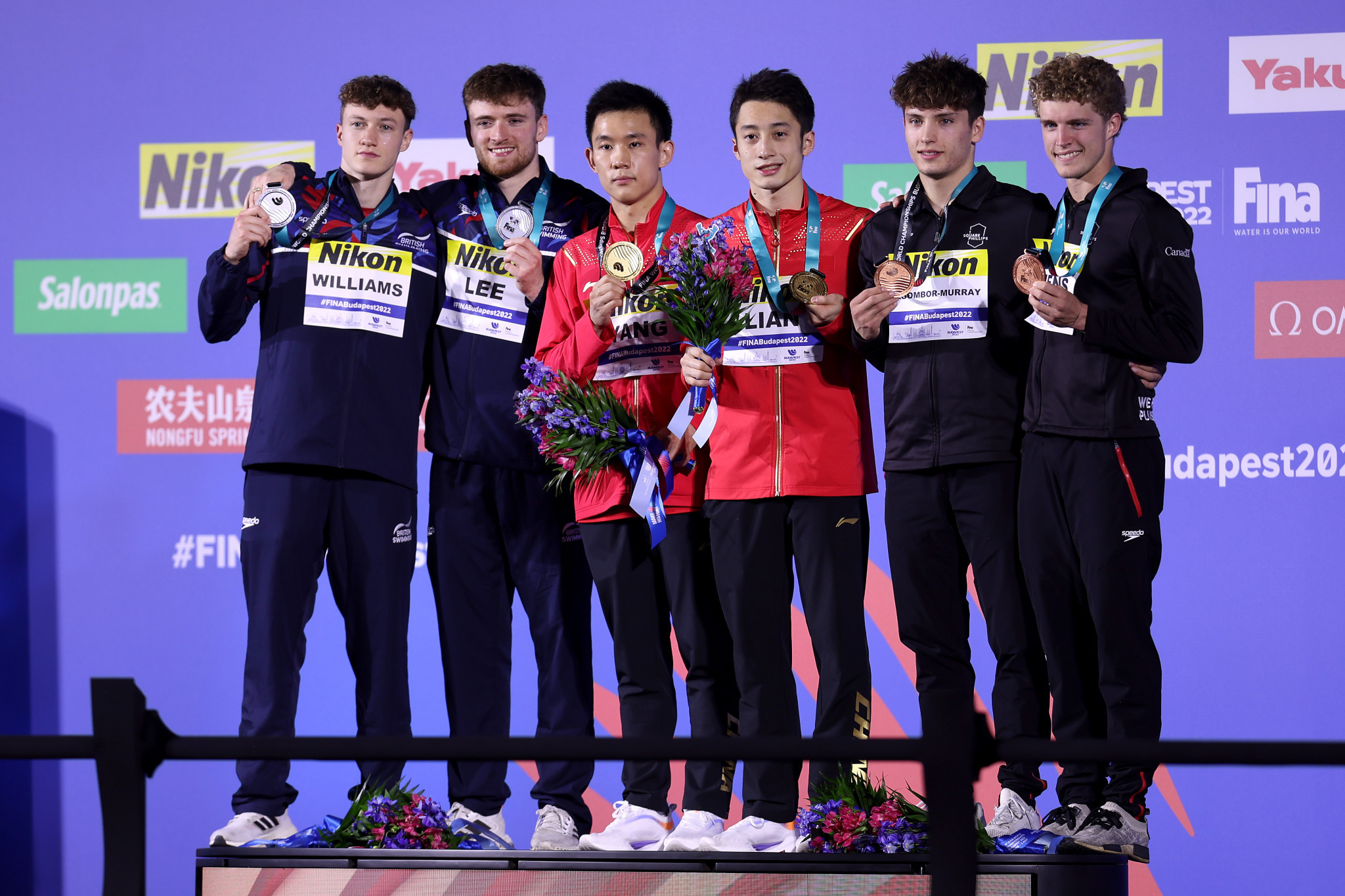 Lian, third right, and Yang, third left, topped the podium which also included Britain and Canada ©Getty Images 