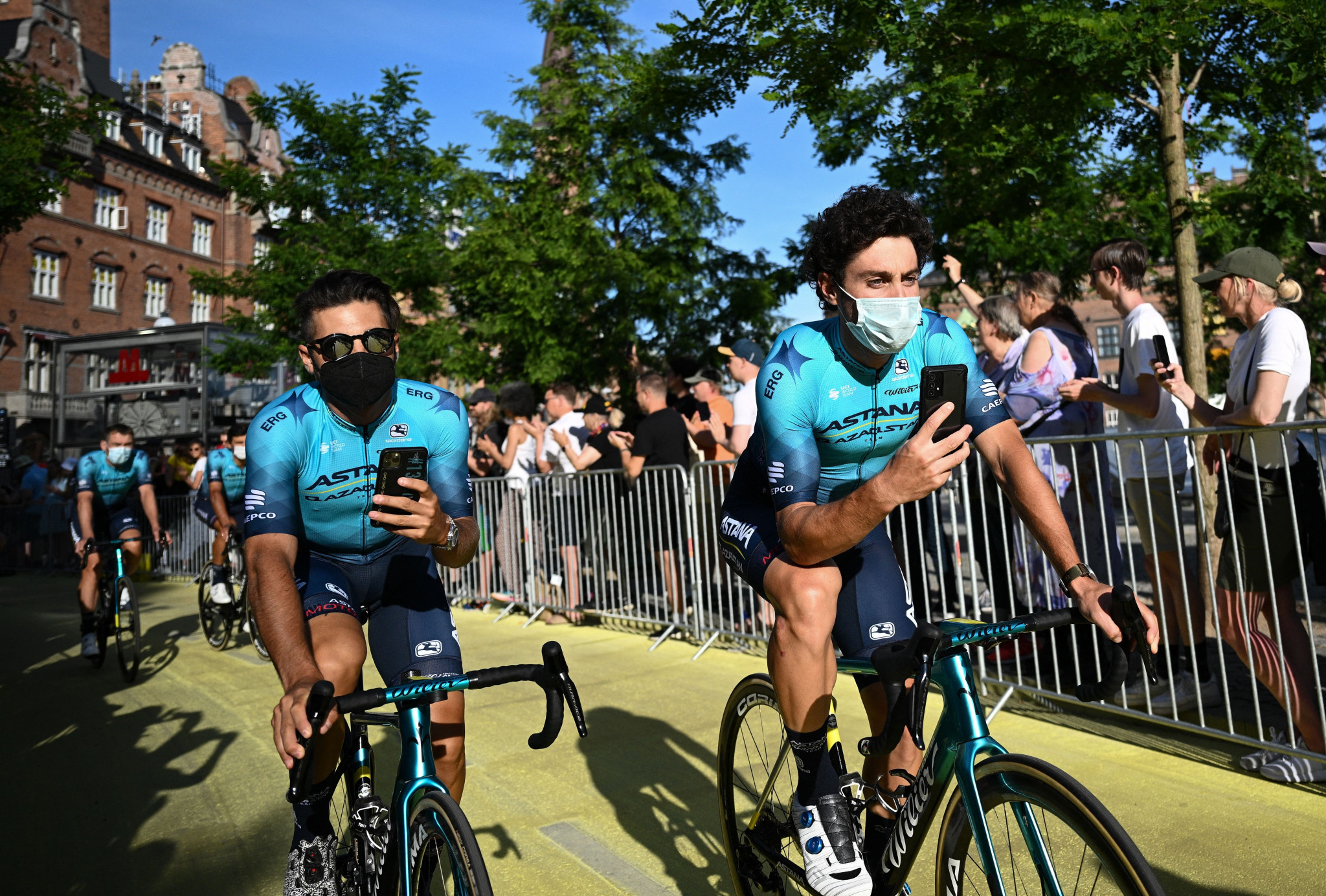 Riders wore masks at the team presentation as part of new COVID-19 rules imposed by the International Cycling Union ©Getty Images