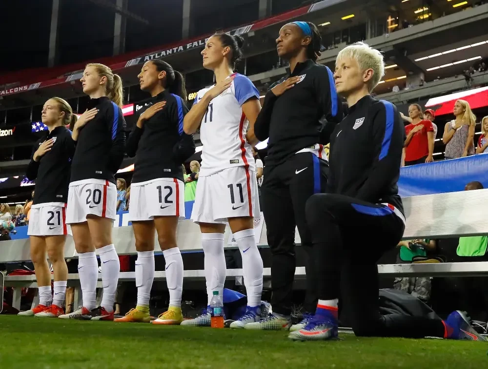 The United States Soccer Federation introduced a rule that players must stand for the national anthem after Megan Rapinoe took the knee for the first time, a rule later reversed following the death of George Floyd ©Getty Images 