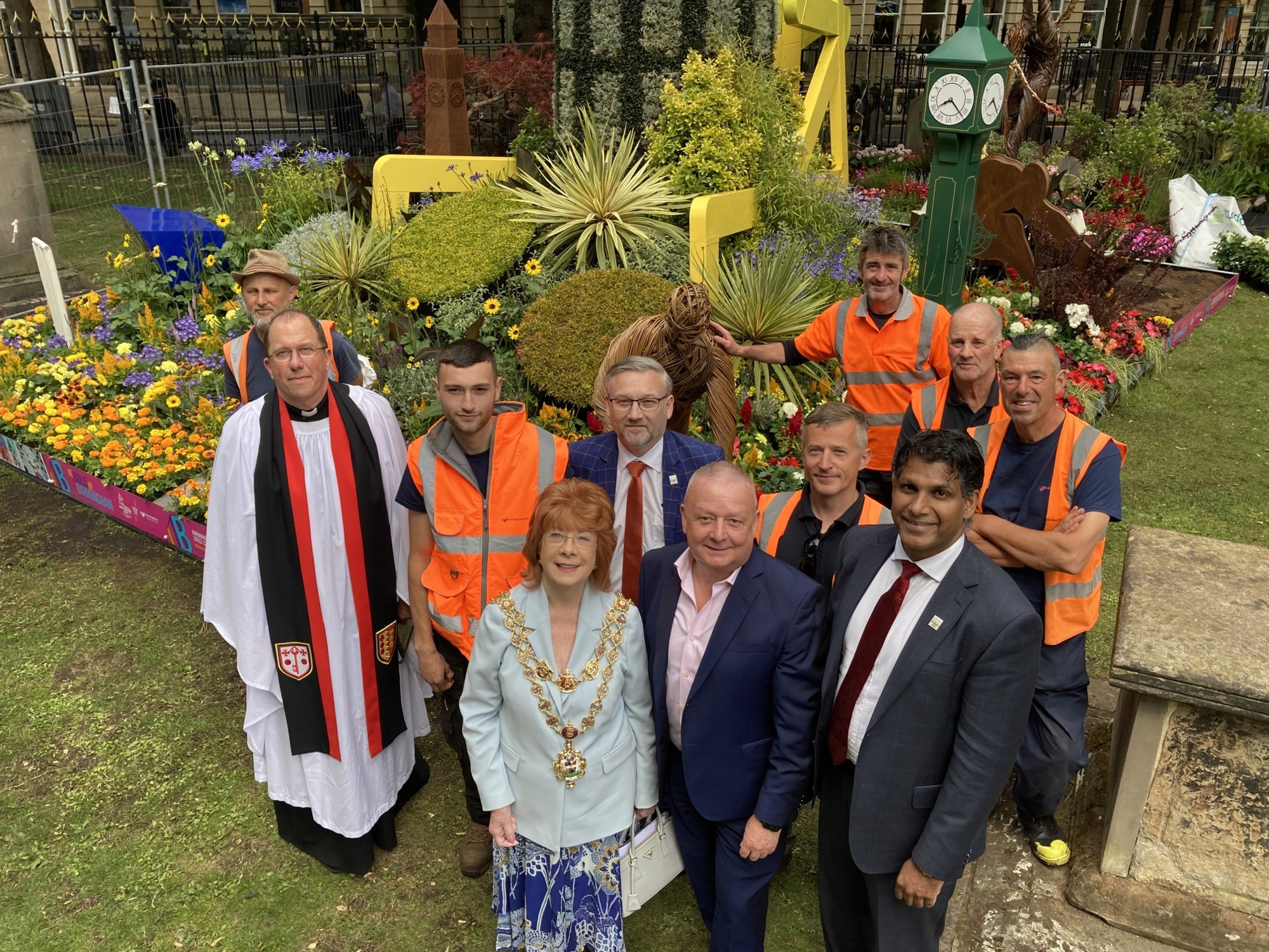 Birmingham Cathedral Dean Matt Thompson(right) Birmingham Lord Mayor Maureen Cornish (front centre) and council environment cabinet member Majid Mahmood join the gardeners and officials at the floral exhibit in the cathedral gardens  ©Birmingham City Coun